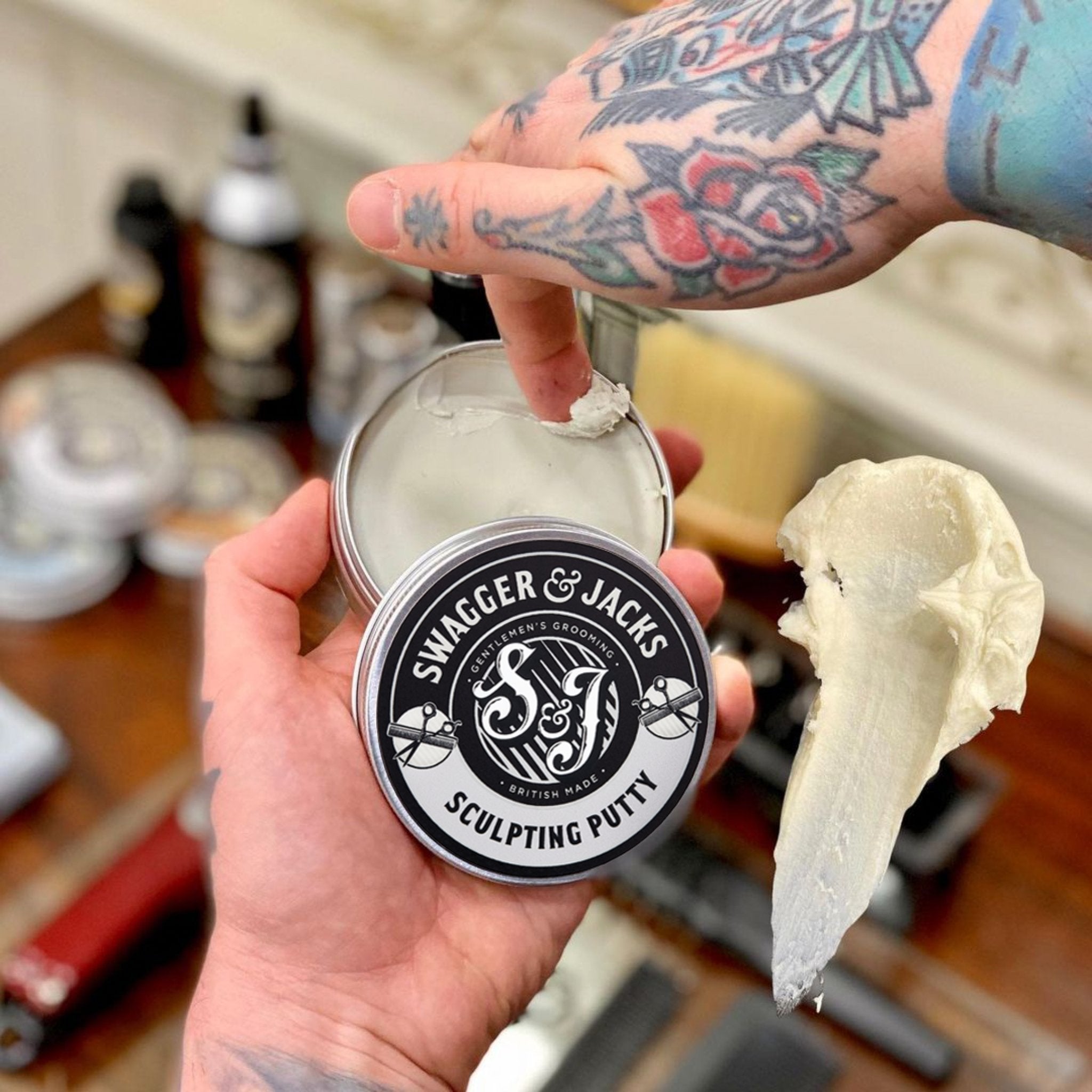Sculpting Putty applied in hand demonstrating smooth, workable hair product texture